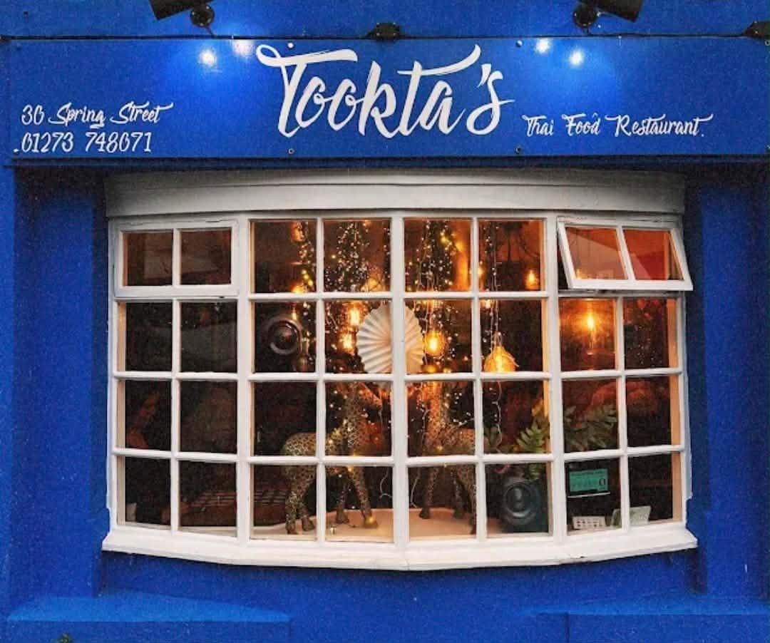Tookta's Thai Restaurant — vibrant blue shopfront on Spring Street Brighton